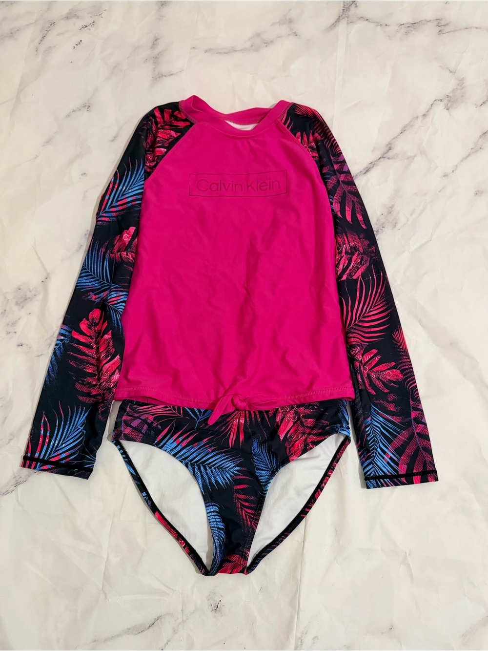 Girls Calvin Klein pink and black two piece swimsuit with blue palm tree leaves